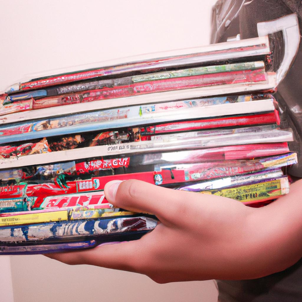 Person holding stack of comics